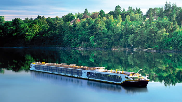 Spirit of the Moselle sailing past a forest